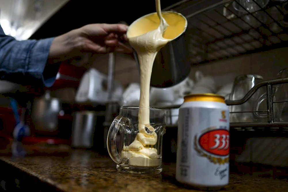 The velvety texture of whipped egg yolk perfectly balances the slight bitterness of the beer, creating a surprisingly smooth sip